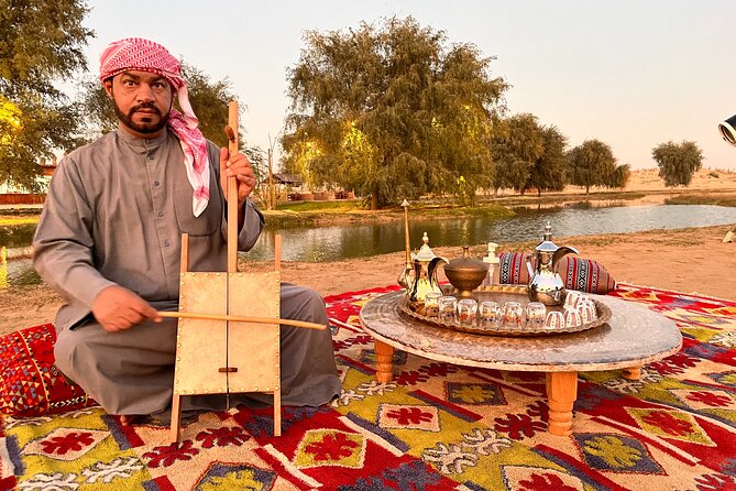 Dubai: Al Marmoom Oasis Vintage Safari: Camels, Stargazing & Meal - Oasis Evening Setup: Sunset Dunes, Falcons, Henna, and Makeovers