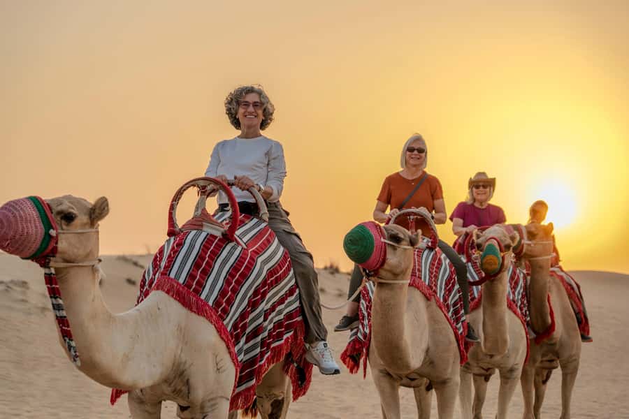 Dubai: Evening Desert Safari with Camel Ride & Stargazing - The drive to the dunes: viewpoints, sunset photos, and animal spotting